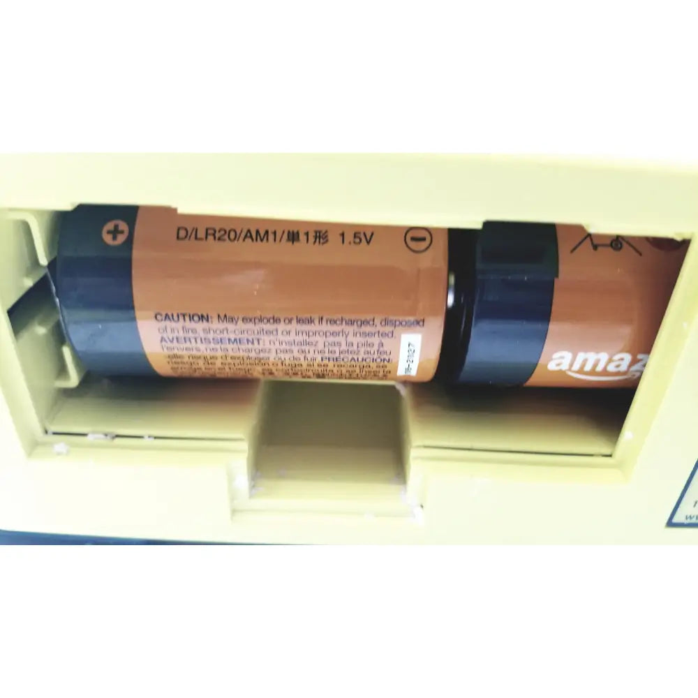 Amazon brand dlr20 am1 1.5v alkaline battery with orange and black casing and caution label for cardiac science AED trainer teaching device