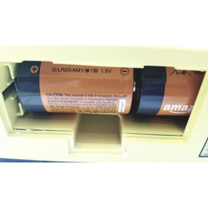 Amazon brand dlr20 am1 1.5v alkaline battery with orange and black casing and caution label for cardiac science AED trainer teaching device