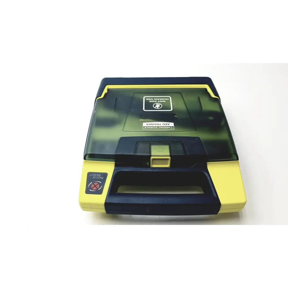 Yellow and black cardiac science aed trainer with transparent lid showing internal components for aed trainer teaching use