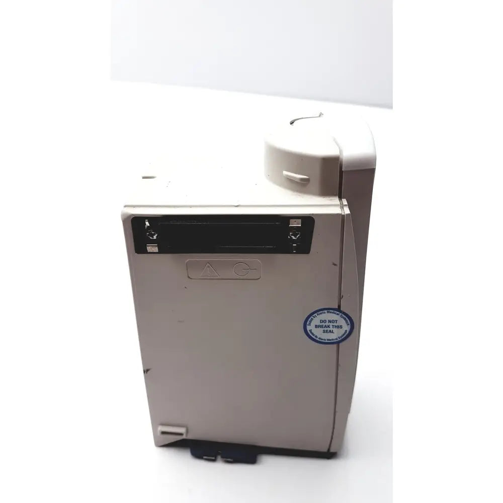 Beige plastic cardinal health alaris sp02 module nellcor oximax with black slot and circular sticker on the side