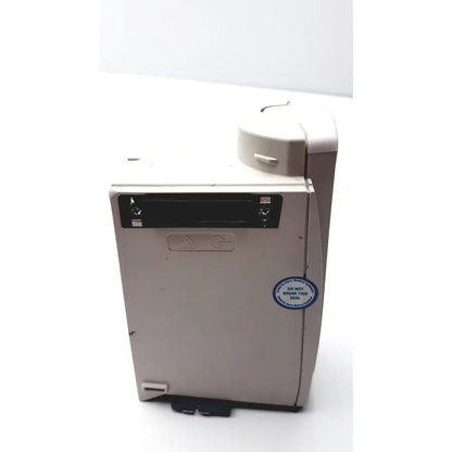 Beige plastic cardinal health alaris sp02 module nellcor oximax with black slot and circular sticker on the side