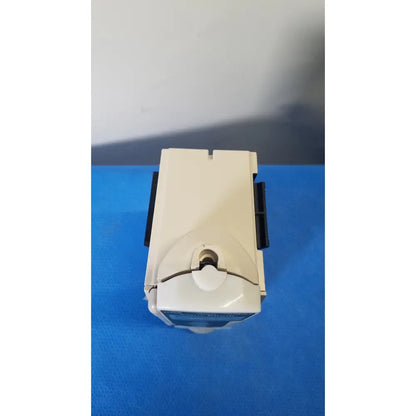 Beige plastic cardinal health alaris pump 8100 series device with black side clips and central circular opening