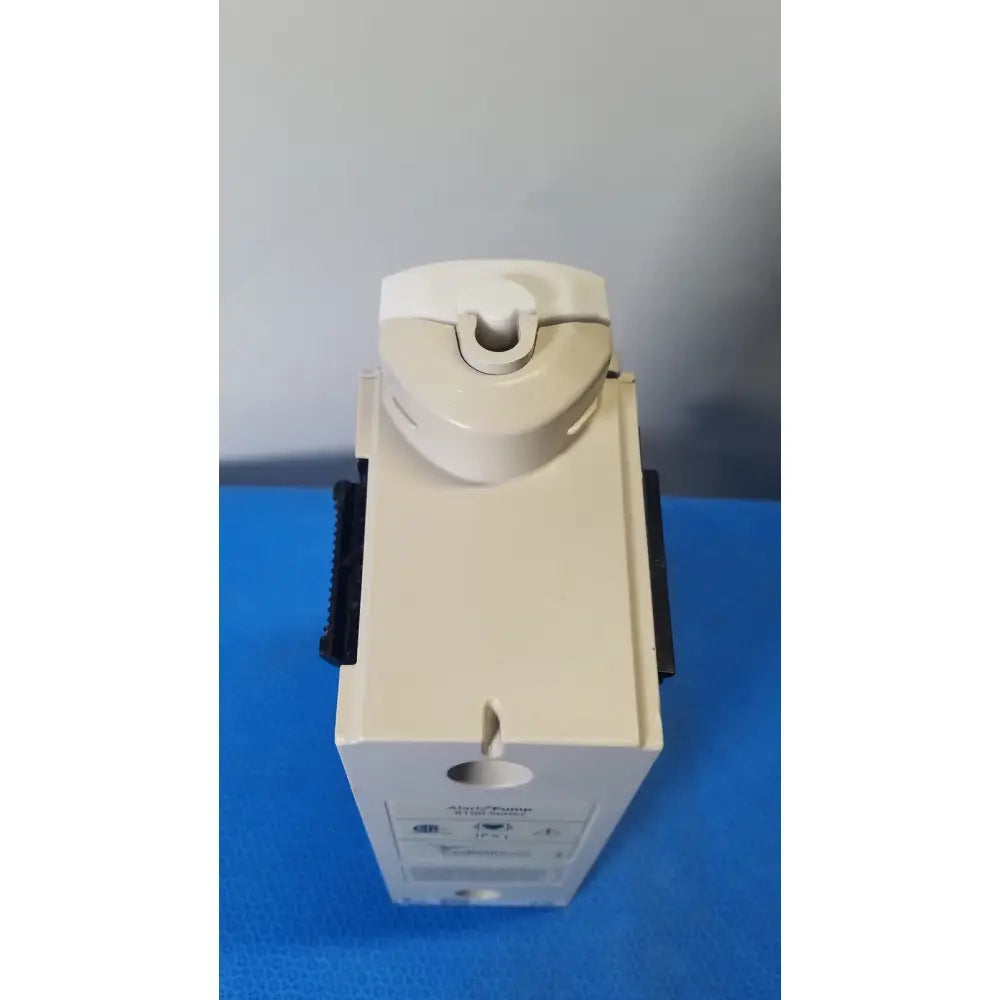 Beige plastic cardinal health alaris pump 8100 series with curved top and black side grips for medical use