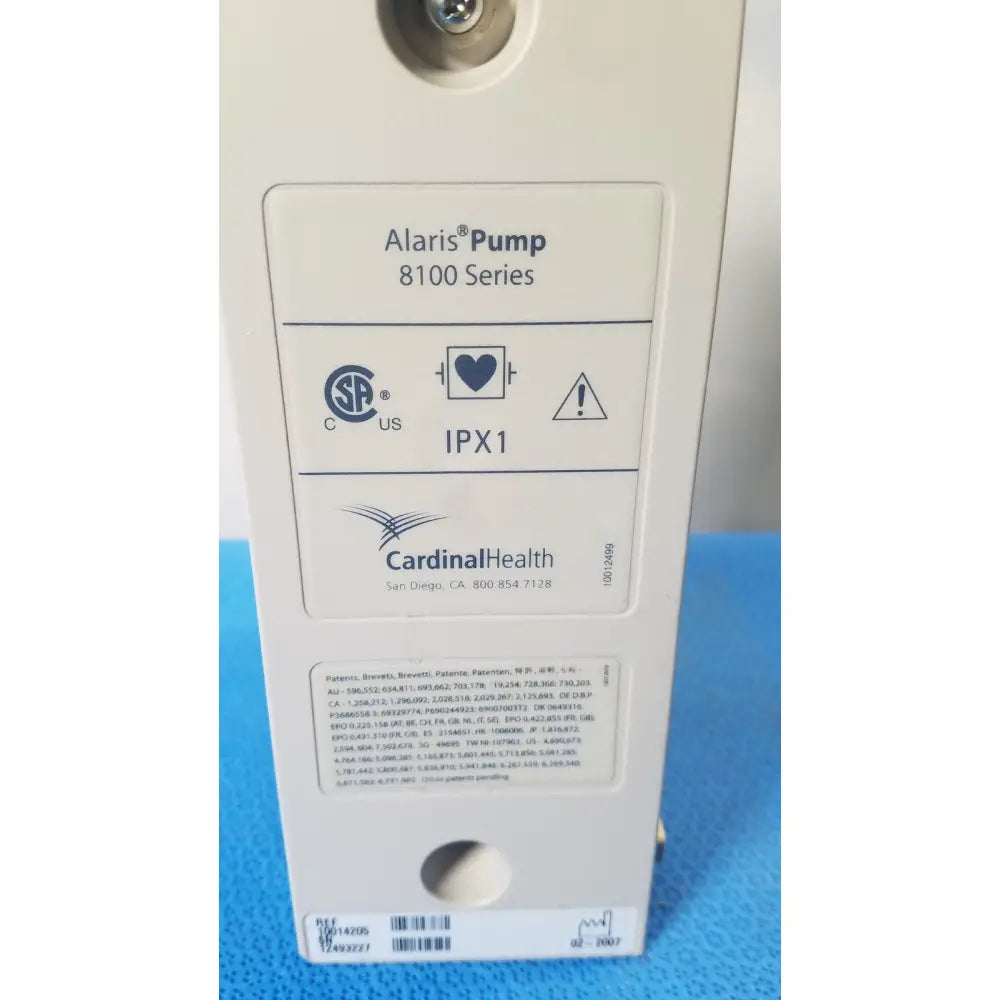 White plastic cardinal health alaris pump 8100 series medical device with certification label and manufacturer information