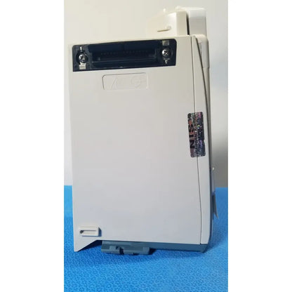 White plastic industrial control module with black connector port and gray base for cardinal health alaris pump 8100 series