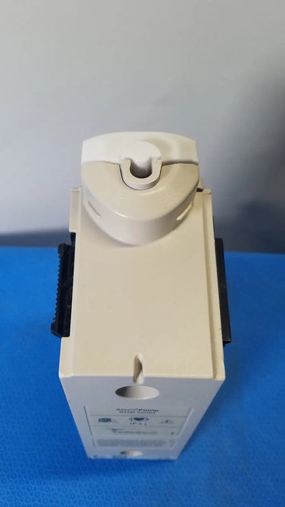 Beige plastic cardinal health alaris pump 8100 series with curved top and black side grips for medical use