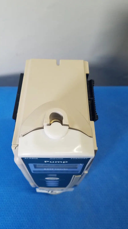 Beige and blue cardinal health alaris pump 8100 series medical infusion pump with digital display labeled pump on front panel
