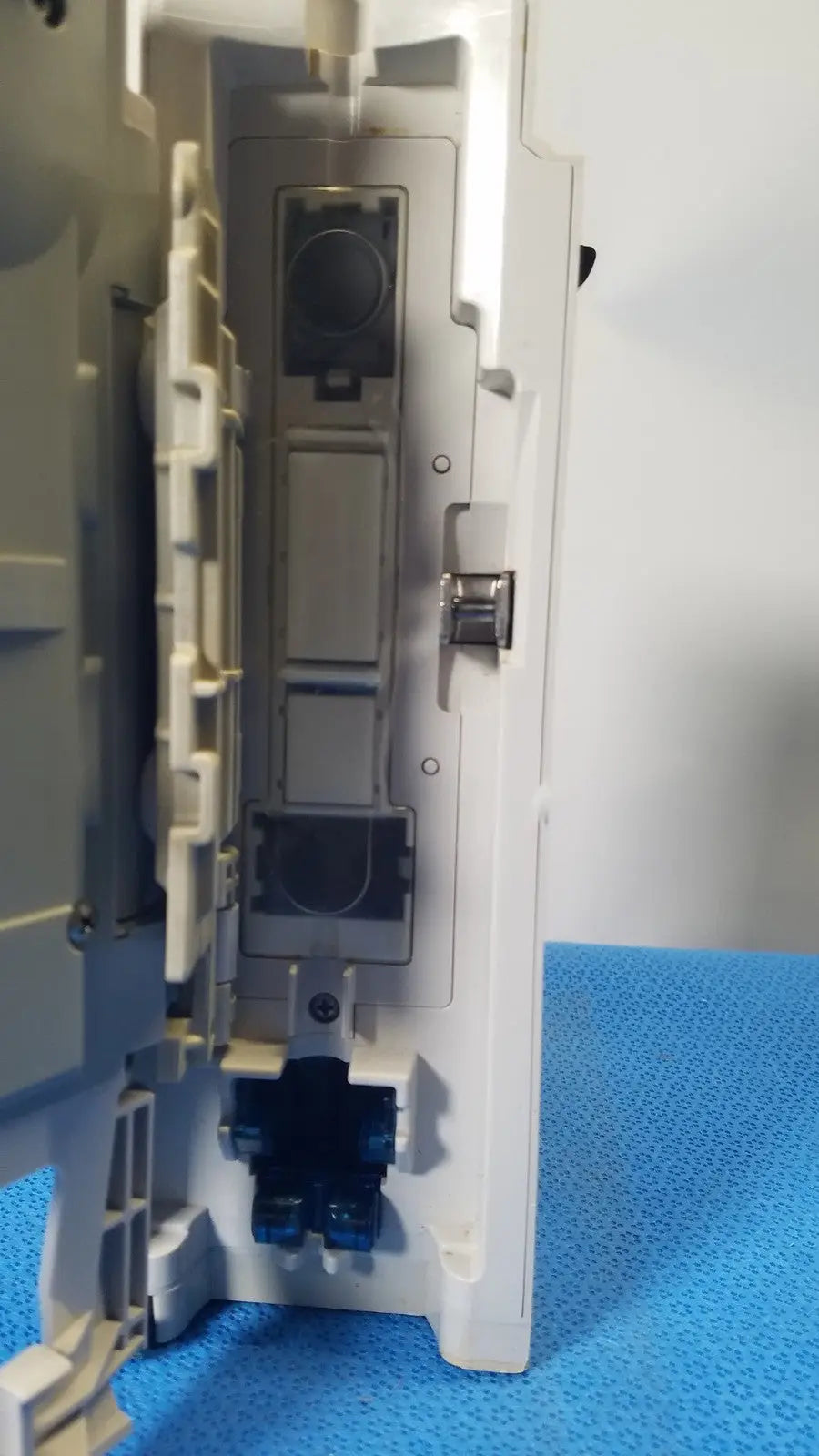White plastic electrical outlet box with gray components and blue connectors for cardinal health alaris pump 8100 series