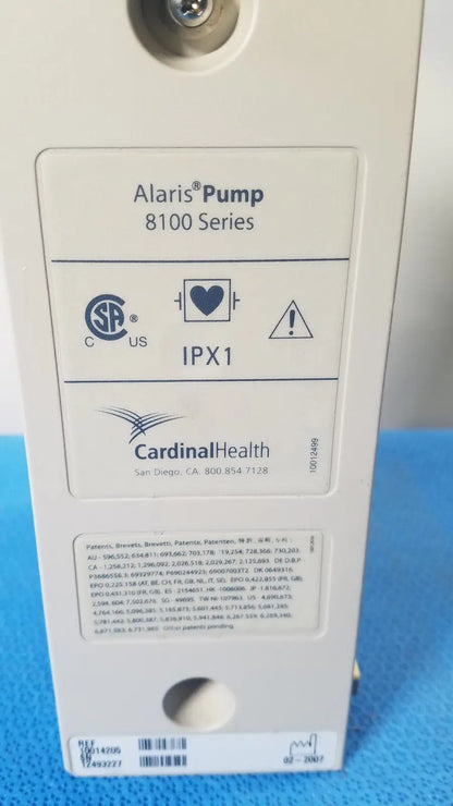 White plastic cardinal health alaris pump 8100 series medical device with certification label and manufacturer information