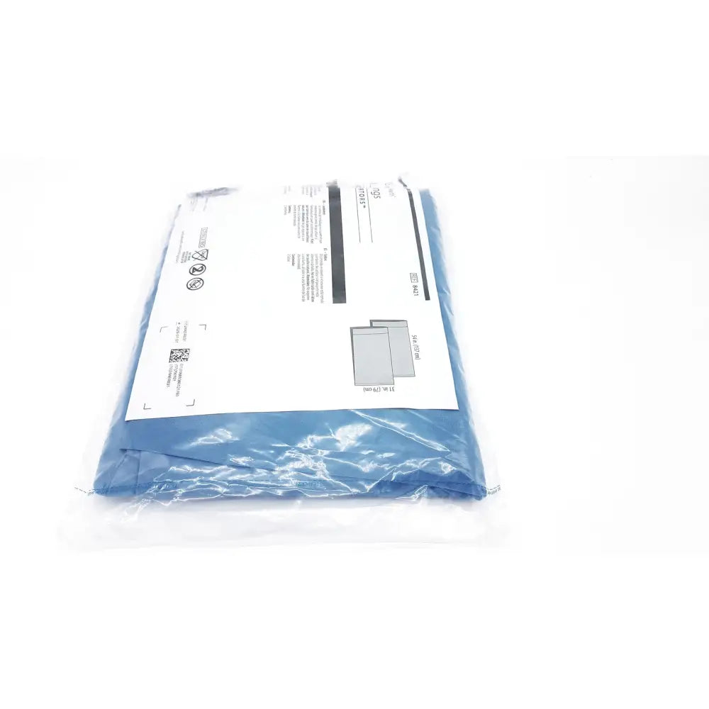 Blue surgical gown in clear packaging with printed instructions cardinal health convertors sterile leggings ref 8421 exp 2029