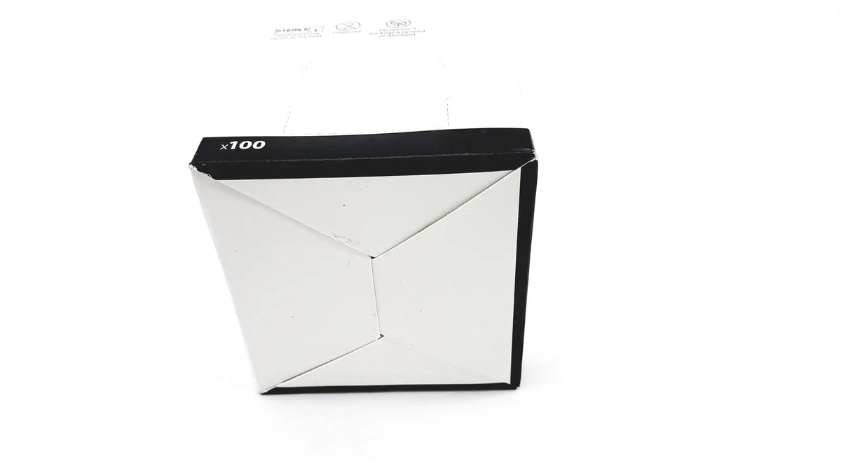Black and white cardboard box of cardinal health gauze pads 3381g with geometric design labeled x100 on top edge