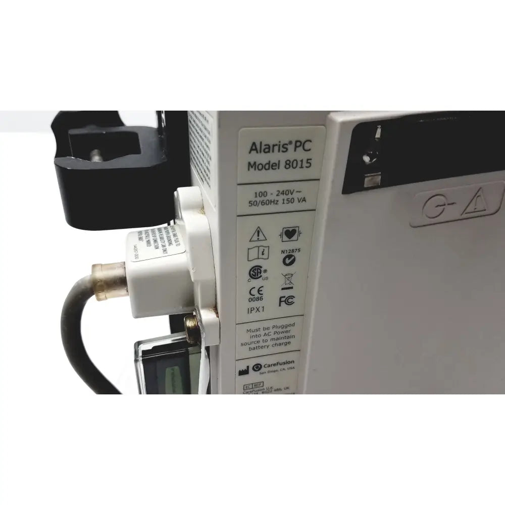 White alaris pc model 8015 medical device with black plastic components and brass connector for cardinal health guardrails suite reuse medical use