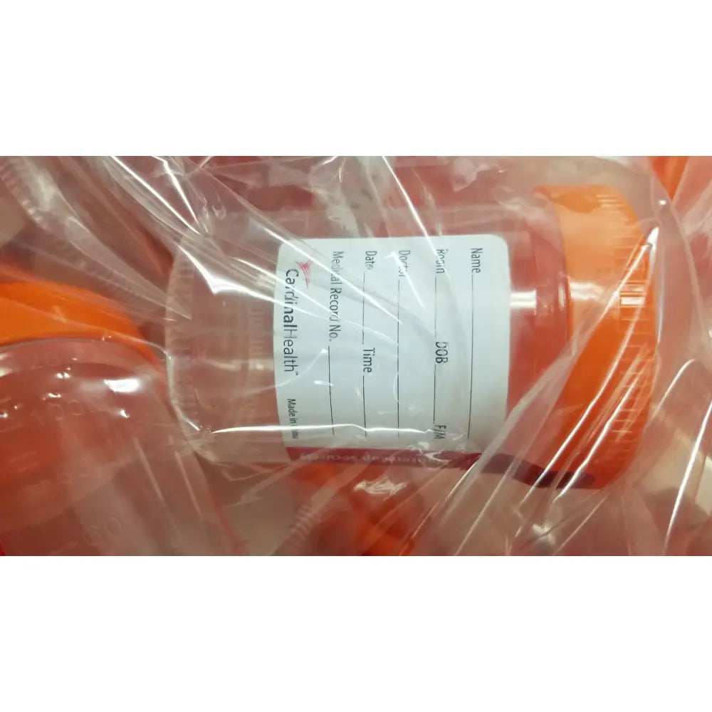 Orange plastic cardinal health specimen cup chb13904a 120ml with white patient information label