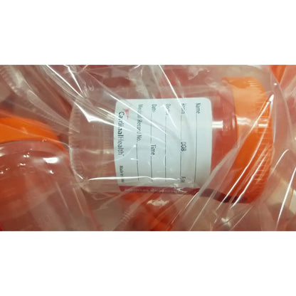Orange plastic cardinal health specimen cup chb13904a 120ml with white patient information label