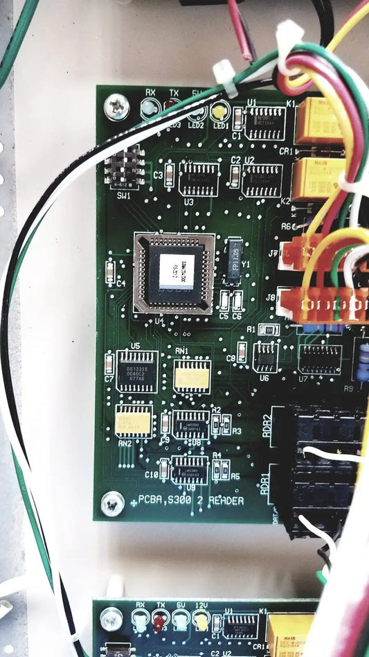 Green printed circuit board with labeled connectors for cardkey s300-xl access control panel controller