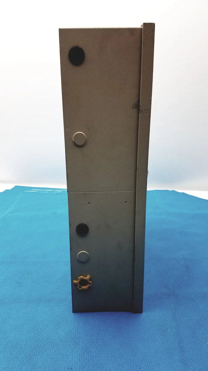 Dark gray metal access control panel controller s300-xl with circular cutouts and orange gear component at the bottom