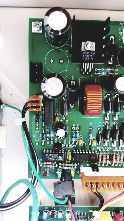 Green printed circuit board with black and silver components for cardkey s300-xl access control panel controller