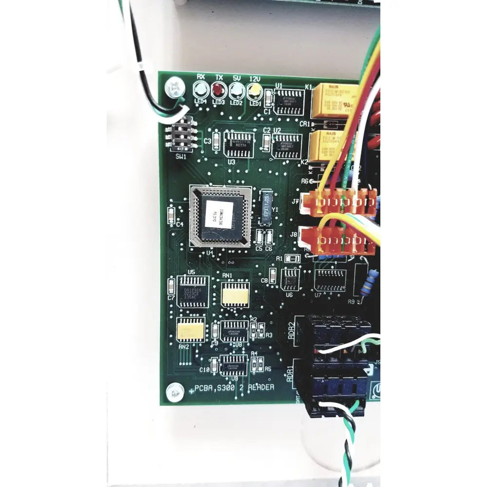 Green printed circuit board with black integrated circuit and connectors for cardkey s300-xl access control panel controller