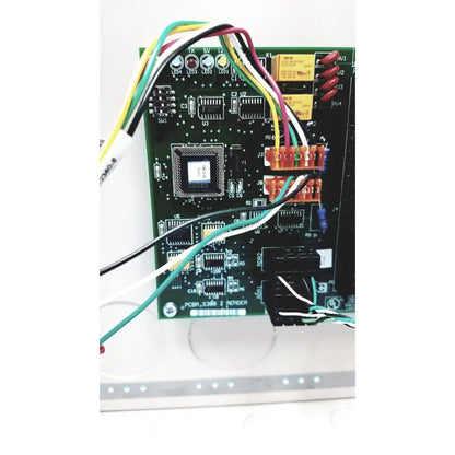 Green circuit board with labeled pcba_s360_2 reyder microprocessor and multicolored wires in s300-xl access control panel controller