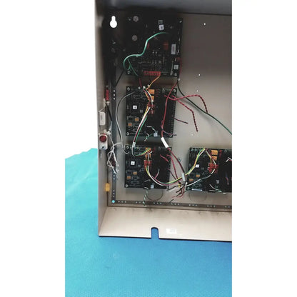 Black circuit boards with colorful wires inside metal enclosure of cardkey s300-xl access control panel controller