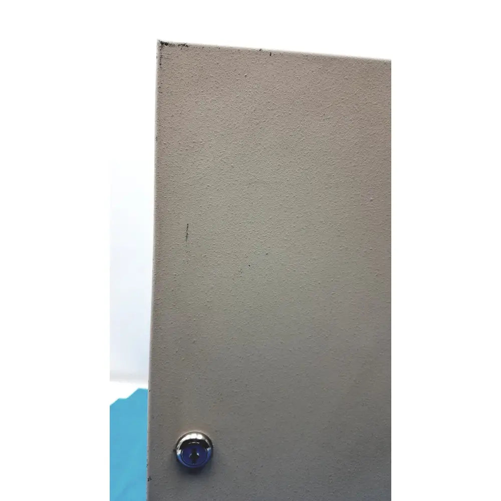 Gray textured door with circular silver keyhole for cardkey s300-xl access control panel controller