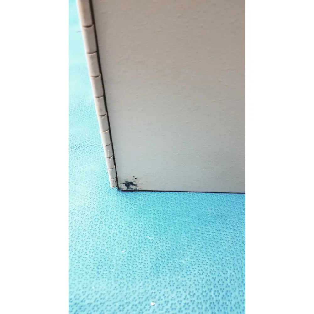 Close-up of the segmented hinge corner joint on the light gray textured s300-xl access control panel controller no key