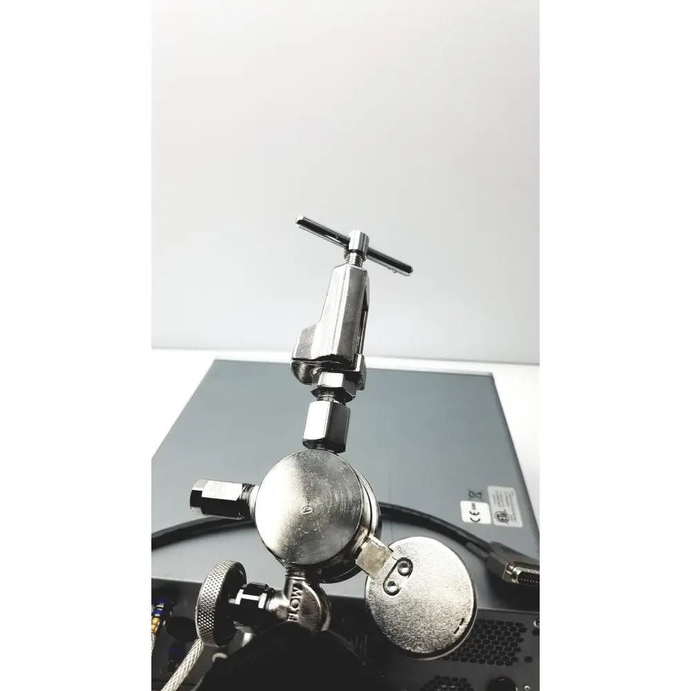 Silver metallic gas regulator with t-shaped handle and threaded connections for carefusion vmax encore analyzer
