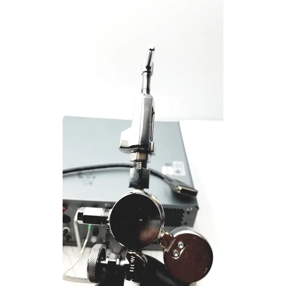 Silver-toned metal gas regulator with black gauge and threaded connections for carefusion vmax encore analyzer gas control