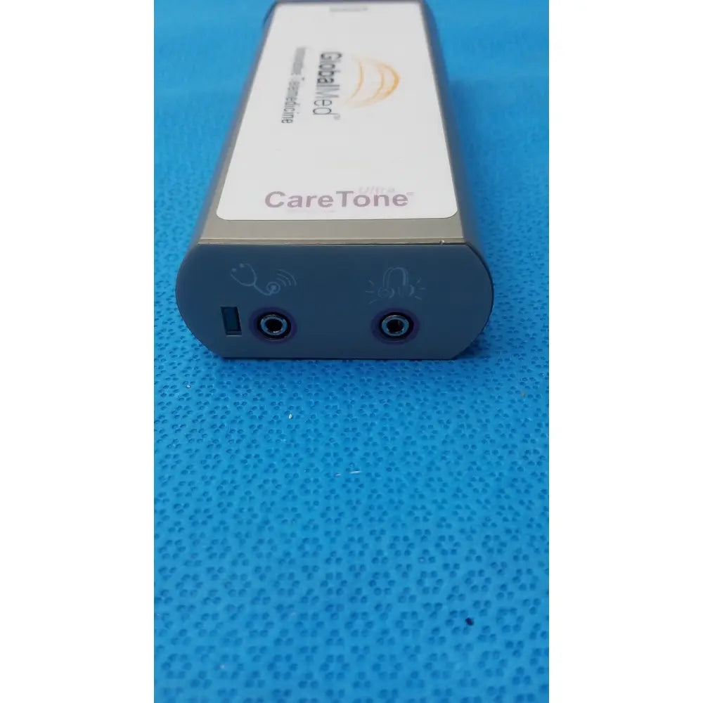 Silver rectangular medical innovative telemedicine device by CareTone Global Medical with two circular side ports