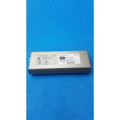 Silver rectangular ati brand power supply unit with matte finish and labels for CareTone Global Medical innovative telemedicine sender
