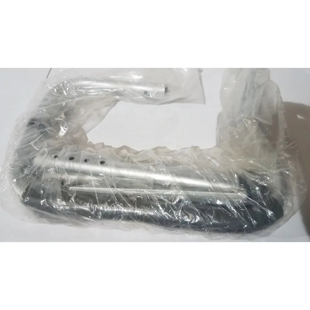 Silver and black metal carex toilet safety frame wrapped in clear plastic with adjustable height and width support rails