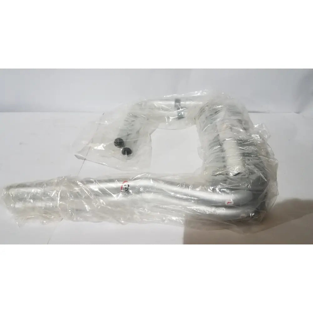 Silver metallic handlebar of carex toilet safety frame wrapped in clear plastic packaging adjustable support rail