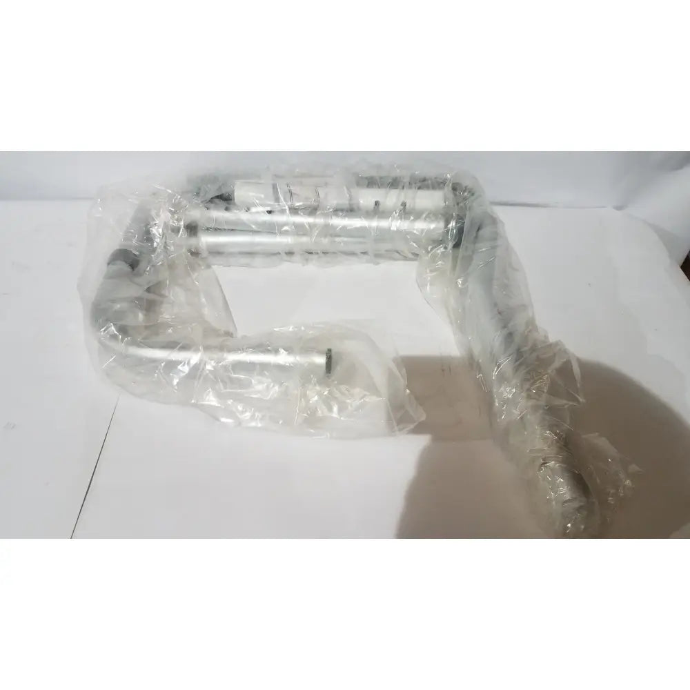 Silver-colored metal pipe assembly wrapped in clear plastic for carex toilet safety frame adjustable height and width support rail