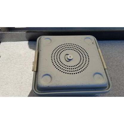 Gray plastic case medical half size sterilization case with circular perforations on lid and rounded corner handles