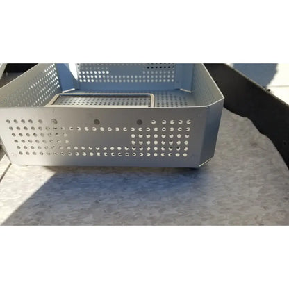 Silver perforated metal storage basket with a rectangular inner tray in case medical half size sterilization case and lid