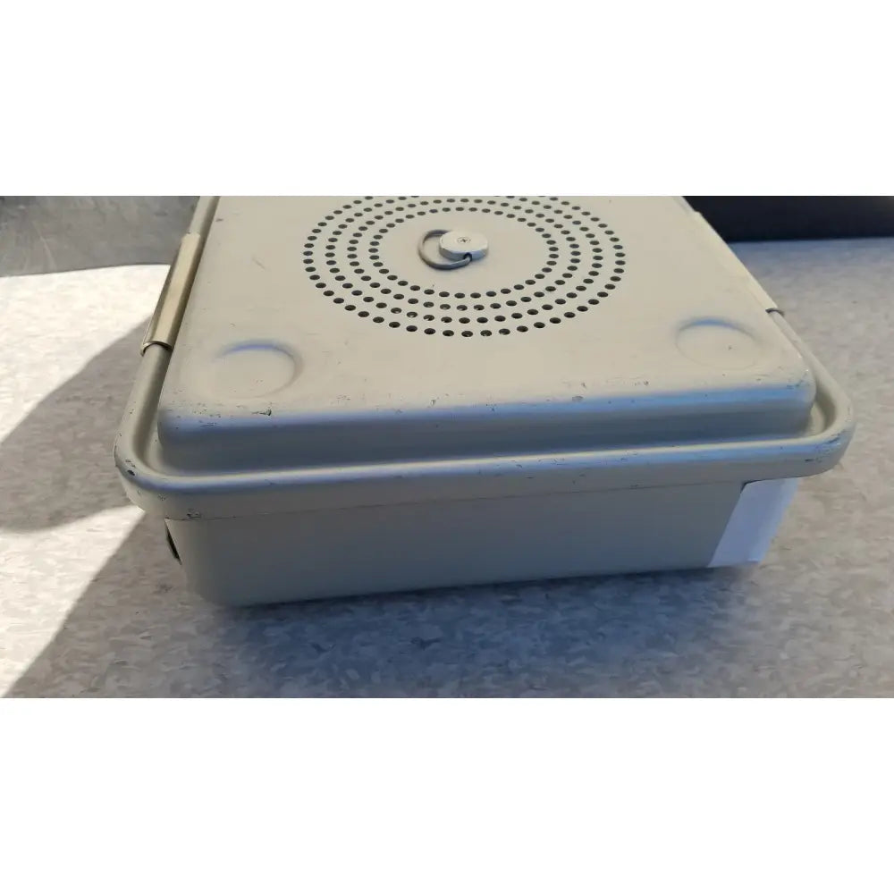 Beige plastic case medical half size sterilization case with circular perforated lid and metal latch for medical use