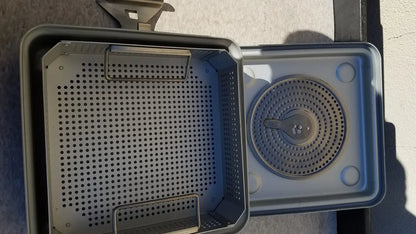 Gray plastic case medical half size sterilization tray with perforated sides and circular grated insert for medical use