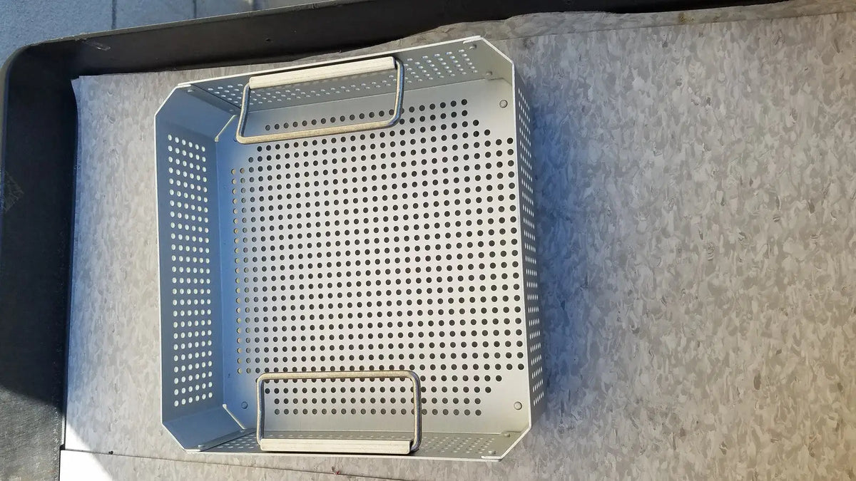 Silver perforated metal grill basket with two handles for case medical half size sterilization use