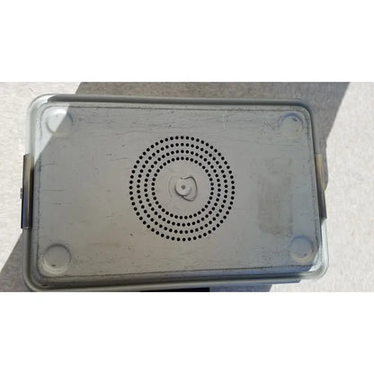 Silver metallic rectangular case medical karl storz storage and sterilization container with circular perforations and rounded corners