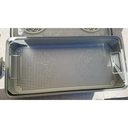 Gray perforated metal sterilization tray with reinforced side handles in case medical karl storz ksz 39402as container