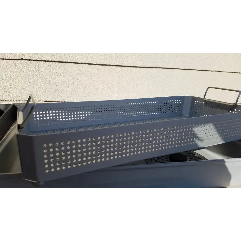 Gray perforated metal grilling tray with integrated handles for case medical karl storz ksz 39402as sterilization container
