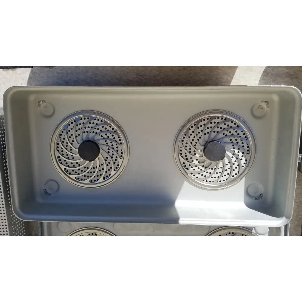 Gray plastic two-burner portable stove with spiral metal grates in case medical karl storz ksz 39402as container