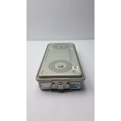 Gray metal case medical solid sterilization container with circular perforated patterns and sturdy handle for medical use
