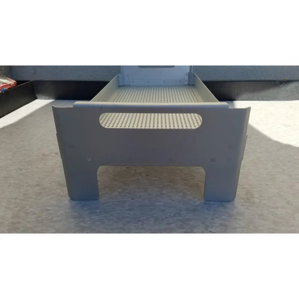 Gray plastic case medical perforated basket with perforated top surface and handle cutouts for sterilization use