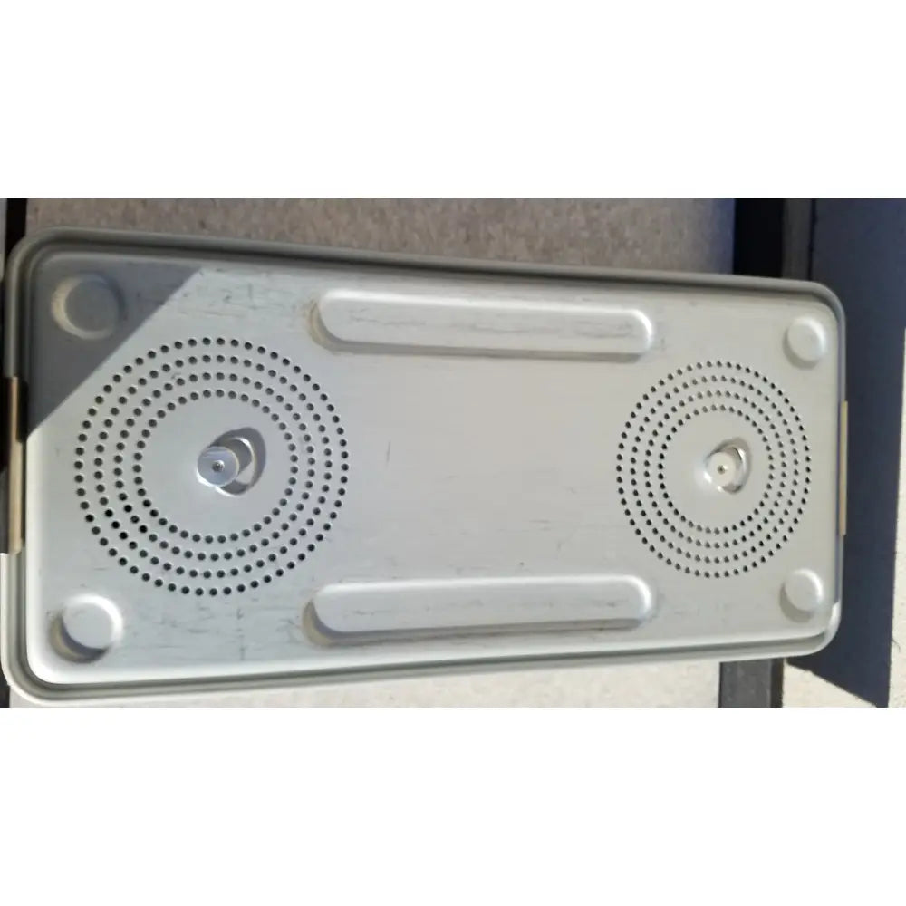Silver metallic rectangular speaker with two circular grilles and rounded corners for case medical storage use