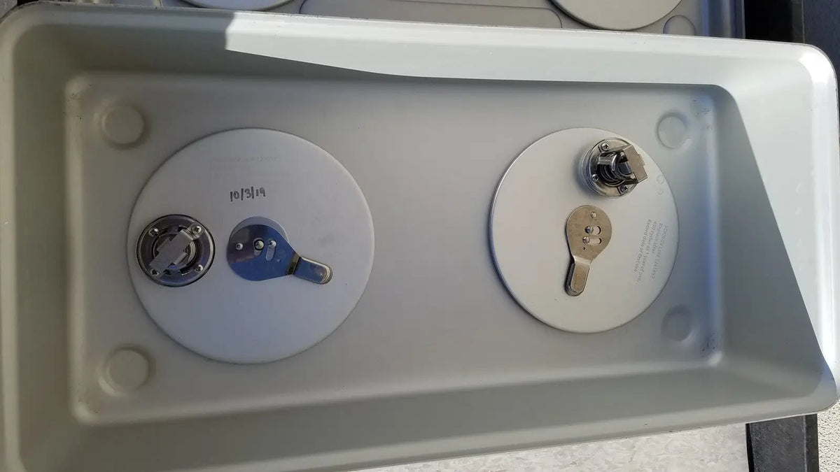 Gray plastic case medical storage container with two circular lids featuring metallic keyhole lock mechanisms