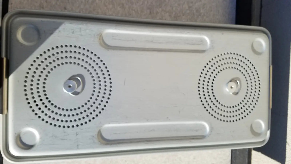 Silver metallic rectangular speaker with two circular grilles and rounded corners for case medical storage use