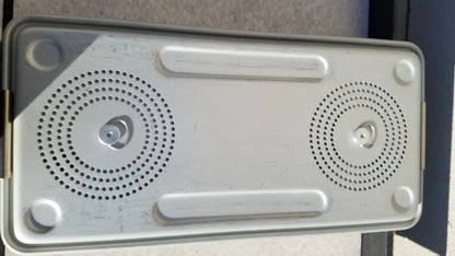 Silver metallic rectangular speaker with two circular grilles and rounded corners for case medical storage use