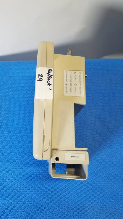 Beige plastic masimo set spo2 blood pressure patient monitor with labeled sections and small protruding connector view
