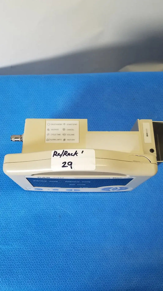 Beige and blue casmed 740 masimo set spo2 blood pressure patient monitor with white re rack 29 label on front